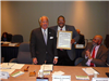 HRTAC Chair William D. Sessoms Jr. Presenting a Resolution of Appreciation to HRTAC Member Kenneth W