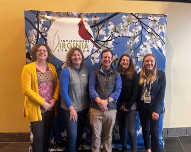 HRPDC Water Resources Team Pose with a sign for the 2025 EVA Symposium